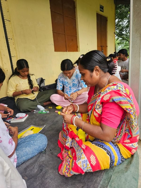 Women learning crochet and knitting together